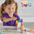 Girl building mathlink cubes numberblocks eleven to twenty on a white table