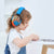 Girl wearing autism ear muffs
