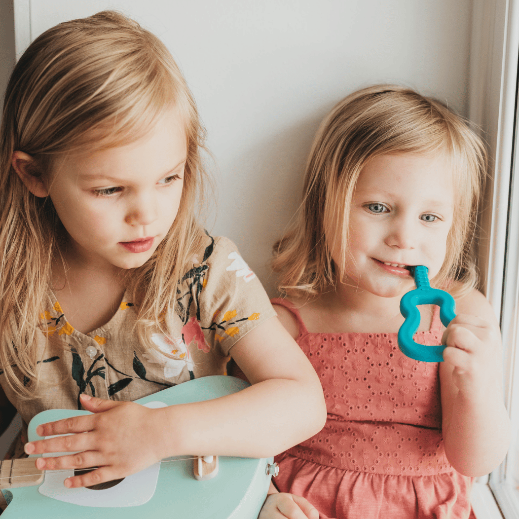 Ark's guitar shaped sensory toys in 6 colors and 3 toughness levels