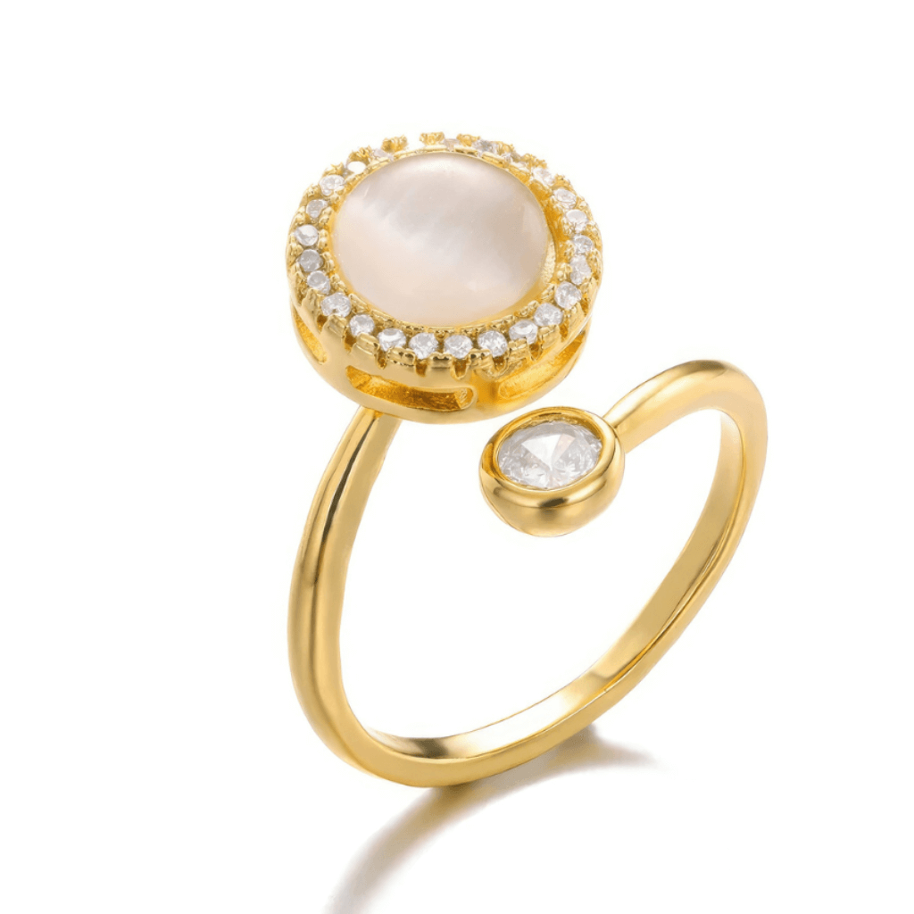 Gold anxiety ring with opal spinning top on white background