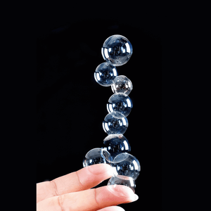 Hand holding stacked touchable bubbles on white background