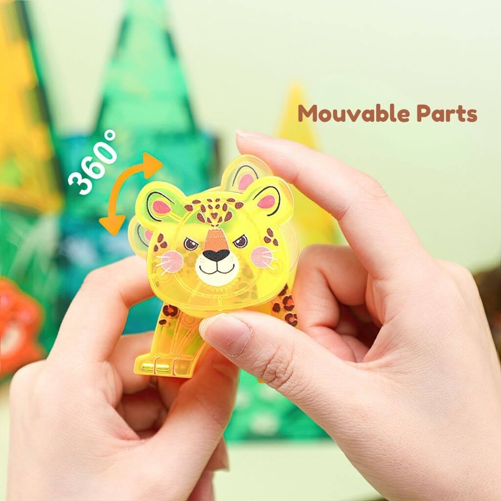 Hand holding a yellow tiger from a magnetic tiles animals set