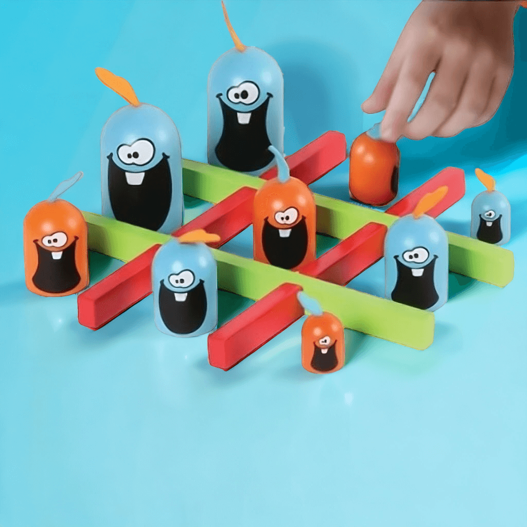 Hand next to wooden grid and gobblers from Gobblet Gobblers game by Blue Orange on blue background