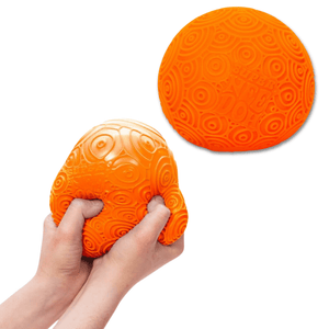 Hands squishing Ripples super nee-doh by Schylling orange