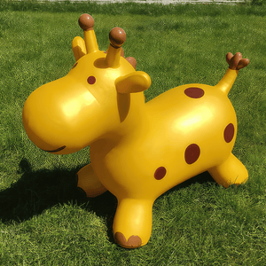 Happy Hopperz Gold Giraffe bouncy rider on the grass