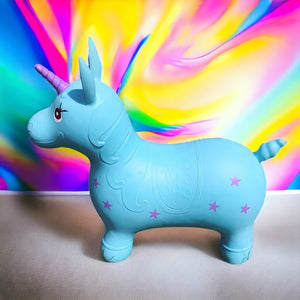 Happy Hopperz Turquoise Unicorn inflatable ride on on colourful background