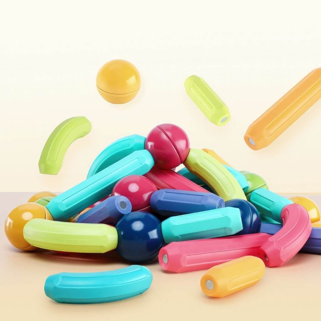 Magnetic children's toys balls and sticks on a orange background