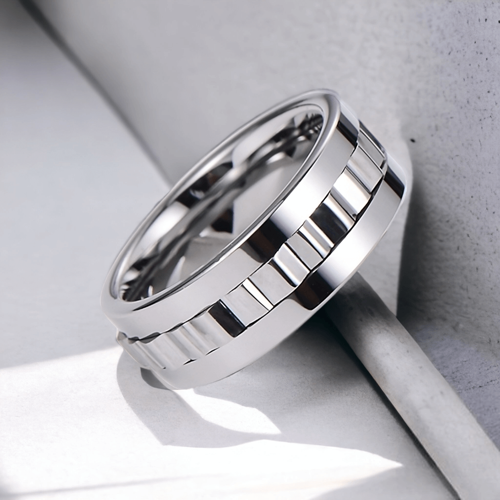 Men's tungsten ring Australia with a textured rotating band on a light gray background