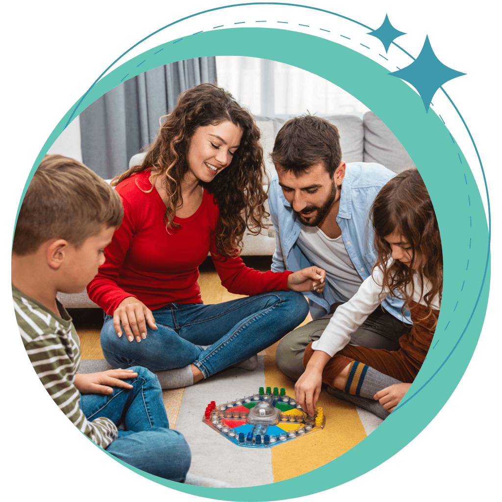 Mom, dad, boy and girl playing a game on the floor