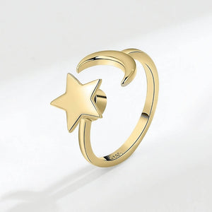 Moon and star gold ring on white background