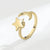 Moon and star gold ring on white background