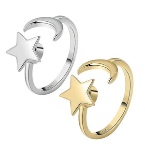 Moon and star ring in gold and silver on white background