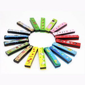 Multi colored wooden harmonicas for kids on a white background