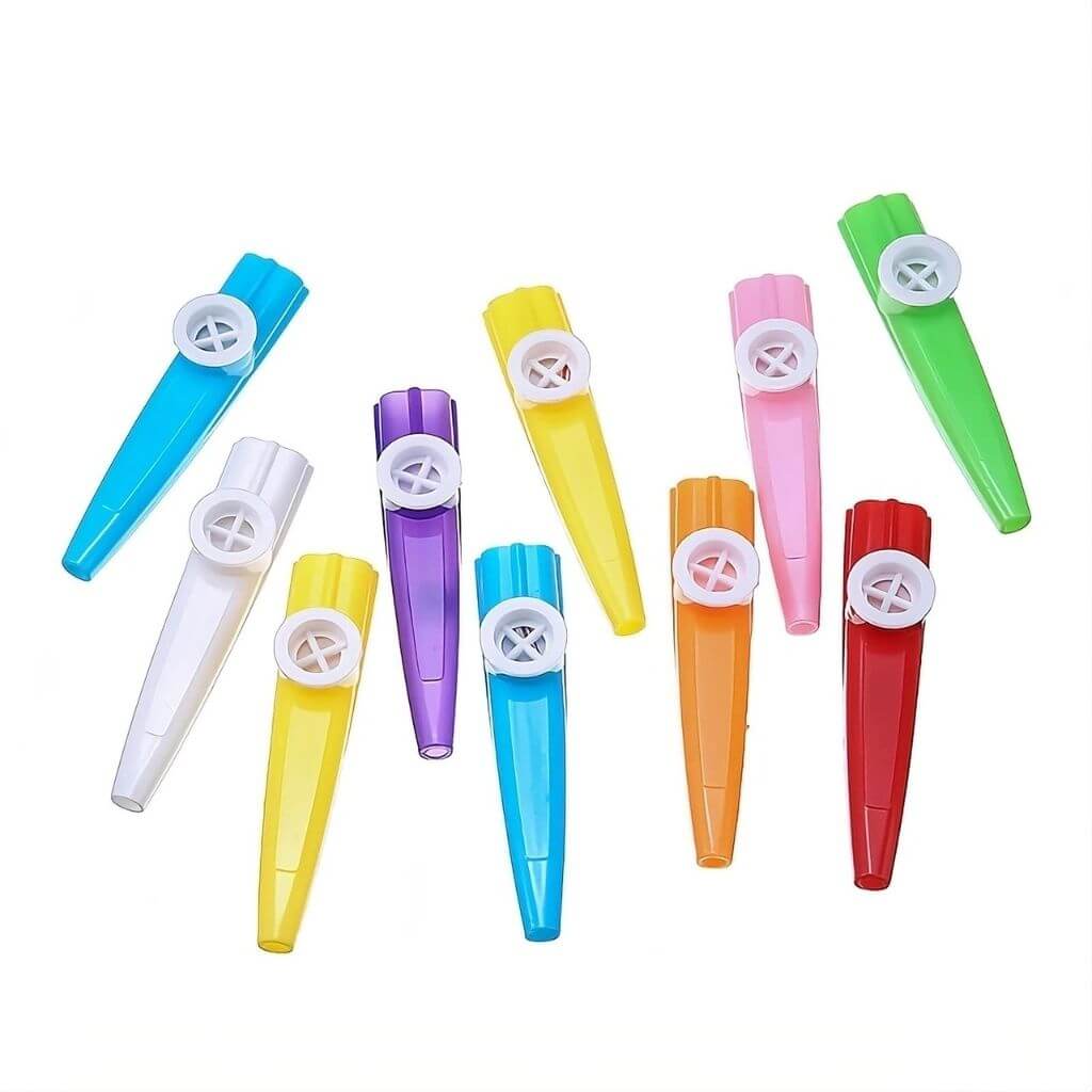 Ten multicolored kazoos lined up on a white background