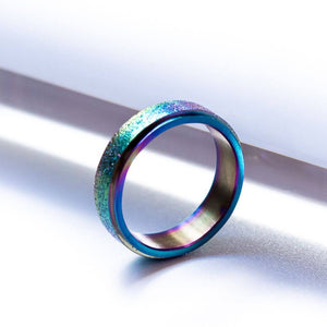Oil slick fidget ring on white background