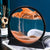 Orange large moving sand art in Australia on a magazine and teal background