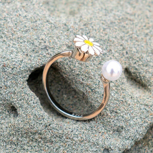 Pearl ring adjustable on a grey rock close up