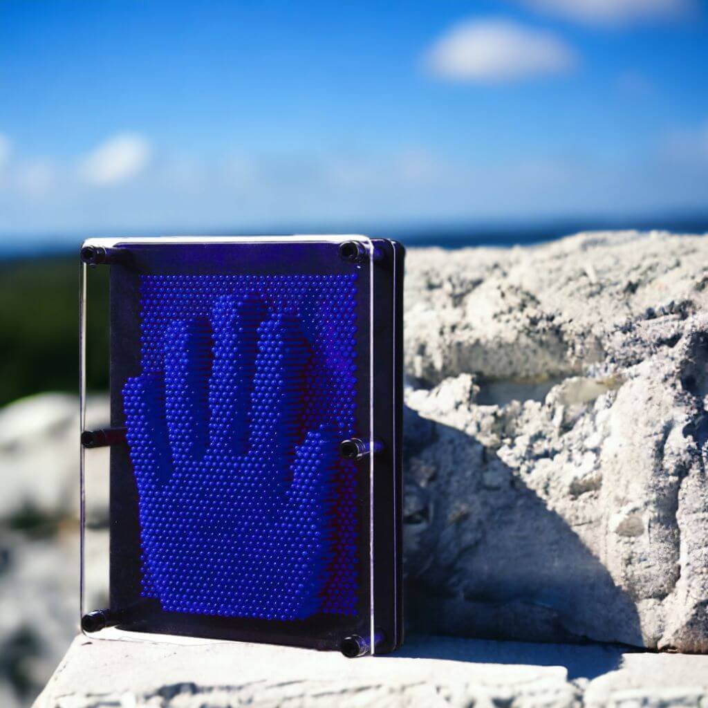 Pin art 3D toy on a rock