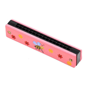 Pink harmonica with bee and flowers on a white background