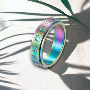 Rainbow daisy ring on white background with shadows