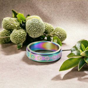 Rainbow flower ring between green plants