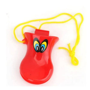 Red duck beak whistle with yellow string close up on a white background
