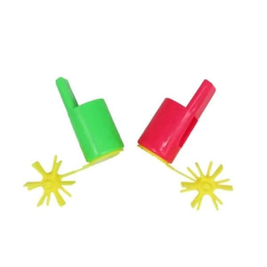 Red and green propeller whistles on a white background