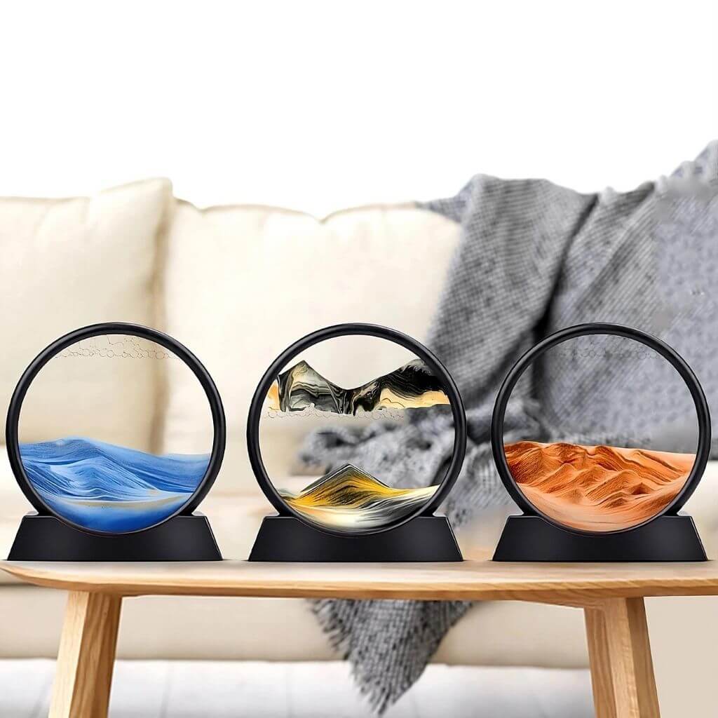 Sand art sandscapes blue, black, orange on a wooden table