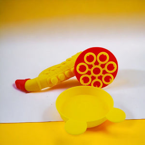Saxophone multiple bubble blower and tray on a white and yellow background