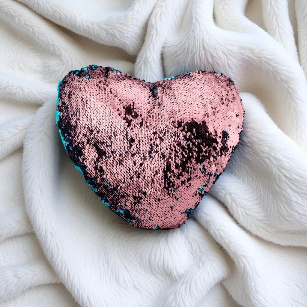 Sequin cushion on a white blanket