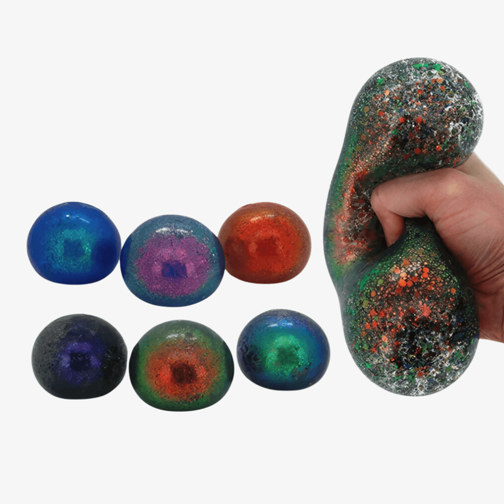 Seven sequin squishy balls on white background