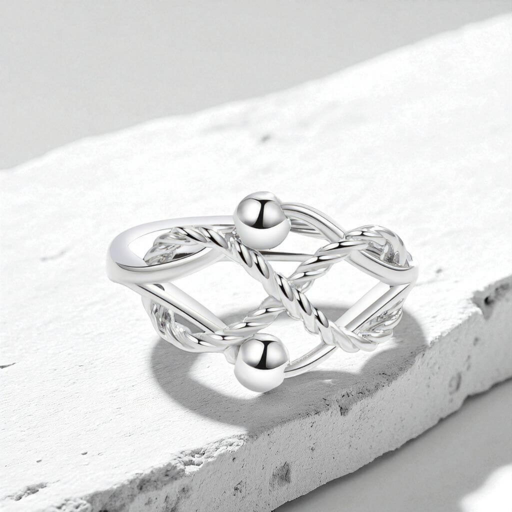 Silver fidget ring with geometric design on a white stone