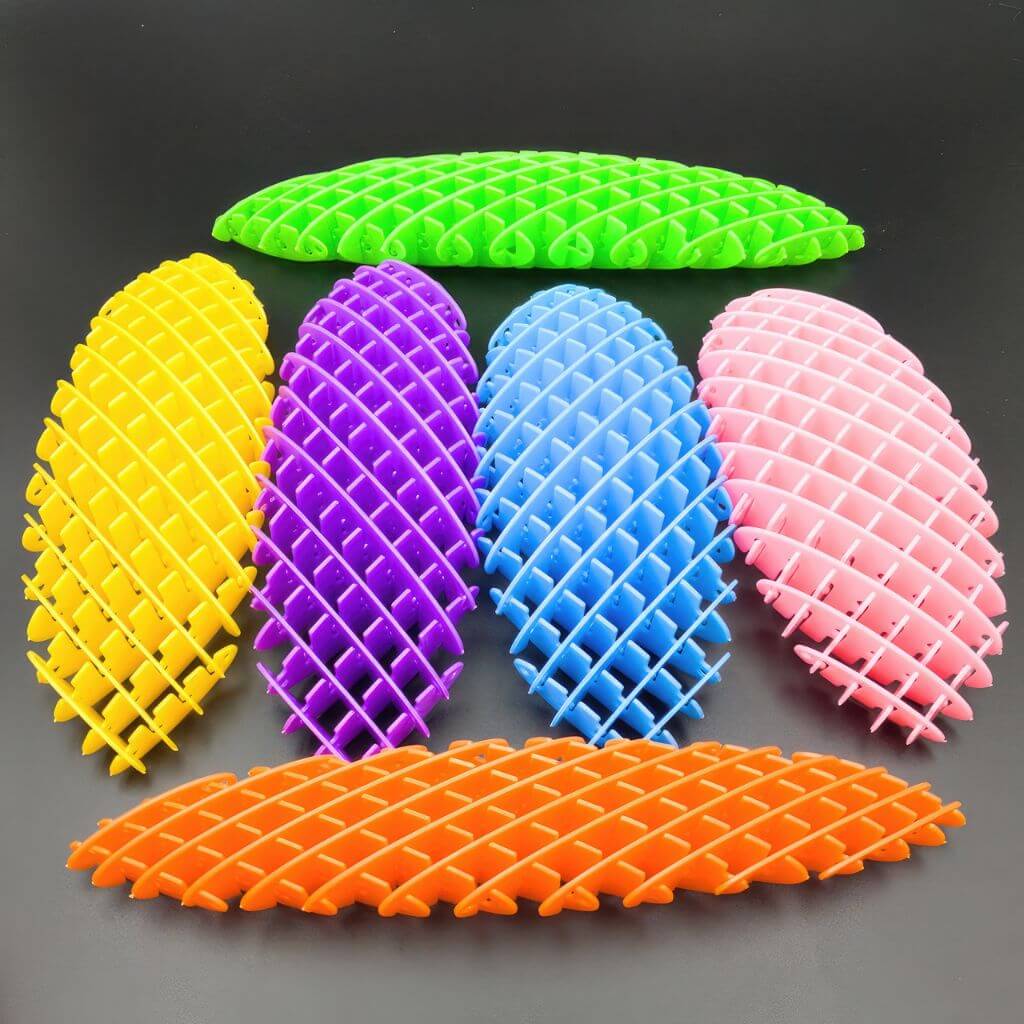 Six fidget worms on a black background