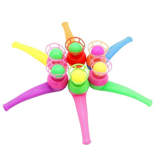 Six multi colored magic ball blow pipes in a circle on a white background
