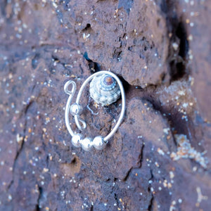 Sterling silver adjustable ring with beads on stone background