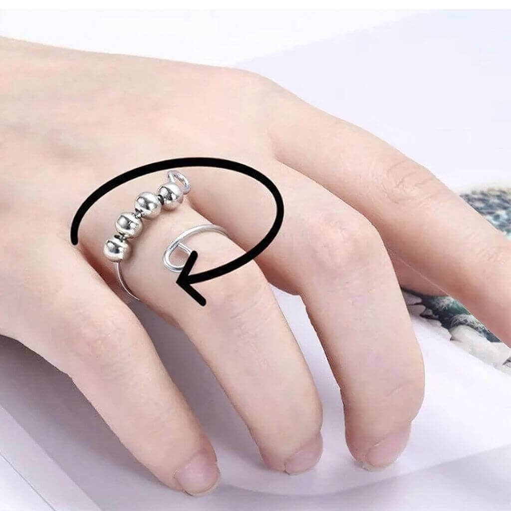 Sterling silver adjustable ring with 4 beads on woman&#39;s finger