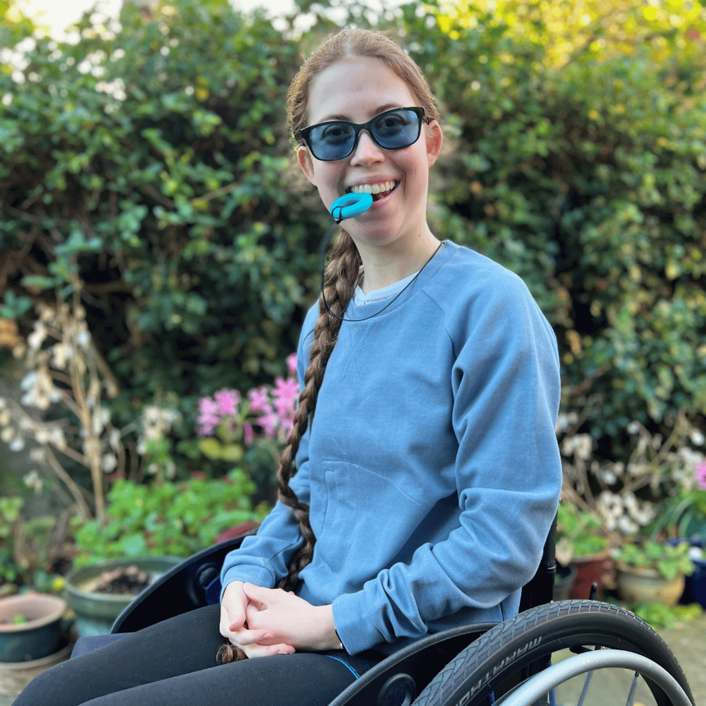 Teenager girl chewing a chewable ring necklace by Ark