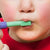 Therapist touching toddler's lips with a Ark Therapeutic Mini Tip for Z Vibe 