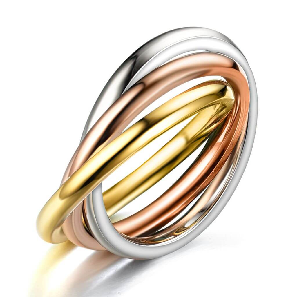 Three interlocking rings in silver, gold, and rose gold on a white background