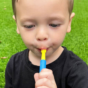 Toddler boy sucking at Ark's Z-Vibe Preefer Tip yellow 