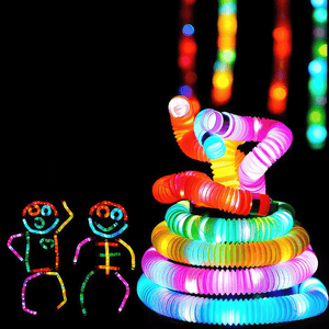 Tower made of luminous pop tubes on black background