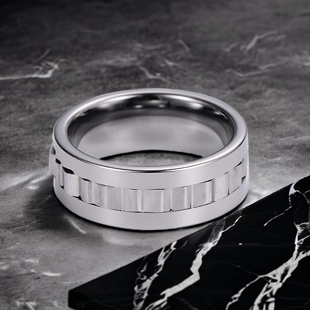 Tungsten ring Australia with a spinning band on a dark marble surface