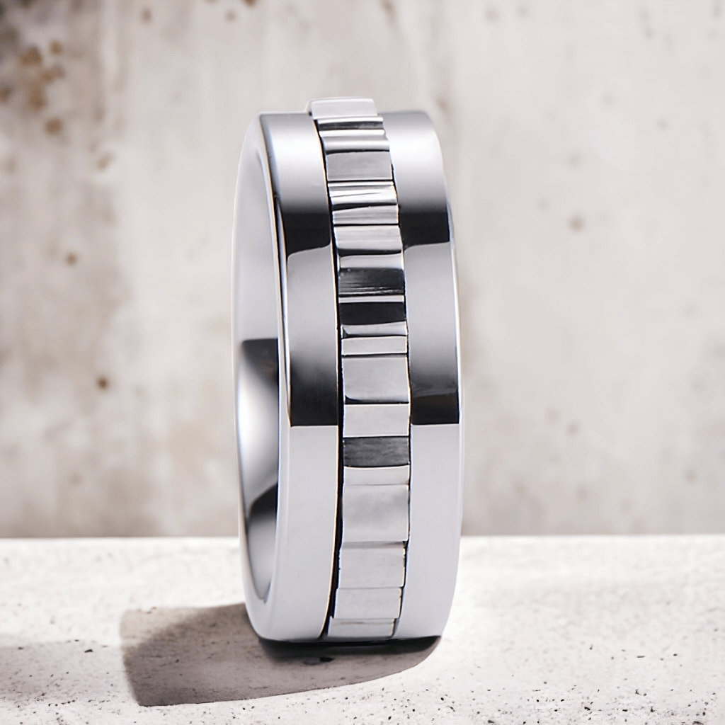 Tungsten ring for men with a textured band on a light gray background