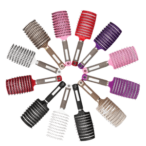 Twelve detangle hair brushes forming a circle on white background