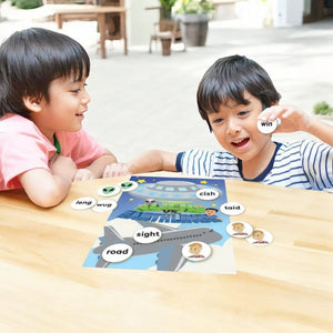 Two caucasian boys playing 6 Phonics Games by Junior Learning at a wooden table