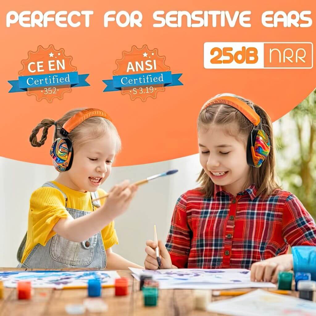 Two girls wearing earmuffs while painting