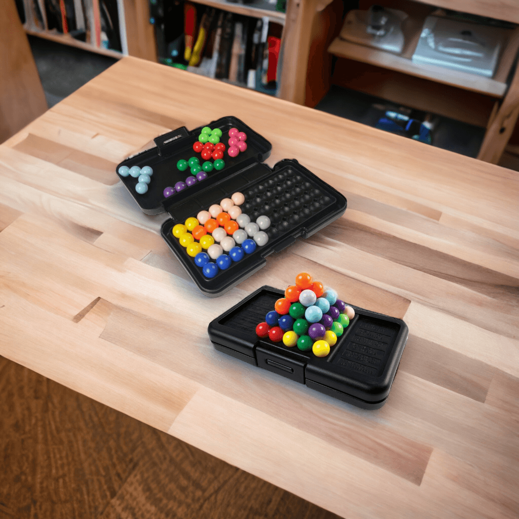 Two kanoodle games on a wooden table in Australia