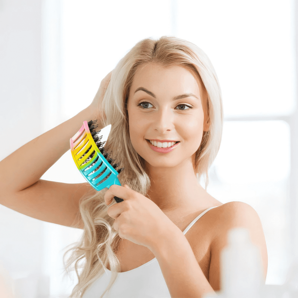 Woman brushing hair with a detangling hair brush