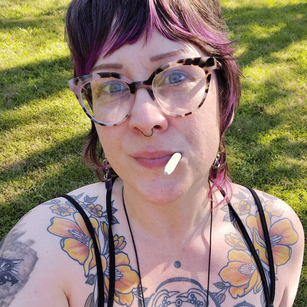 Woman chewing a Ark Chewth Pick Chewable Toothpick