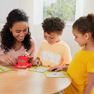 Woman  two children playing Zingo bingo game Thinkfun